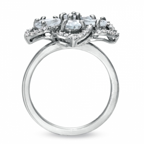 Женское кольцо из серебра с аквамарином и топазами