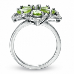 Женское кольцо из серебра с перидотом и топазами
